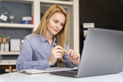 medium-shot-woman-working-with-laptop