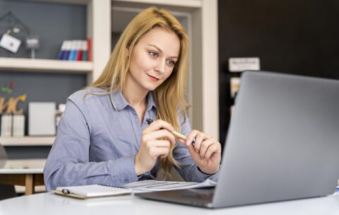 medium-shot-woman-working-with-laptop